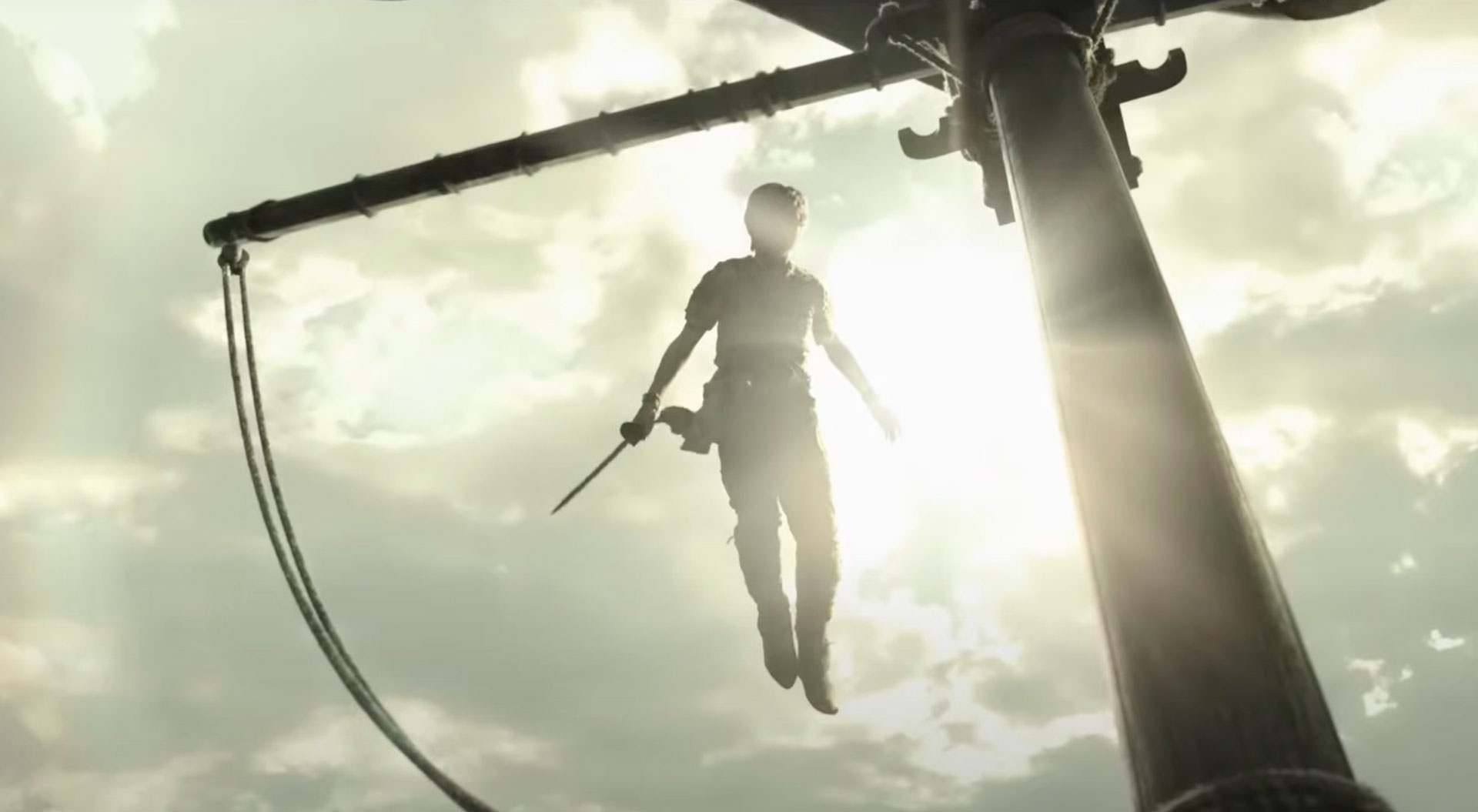 پیتر پن در حال پرواز با شمشیری در دست در یک نمای ضد نور خورشید در فیلم پیتر پن و وندی به کارگردانی دیوید لاوری